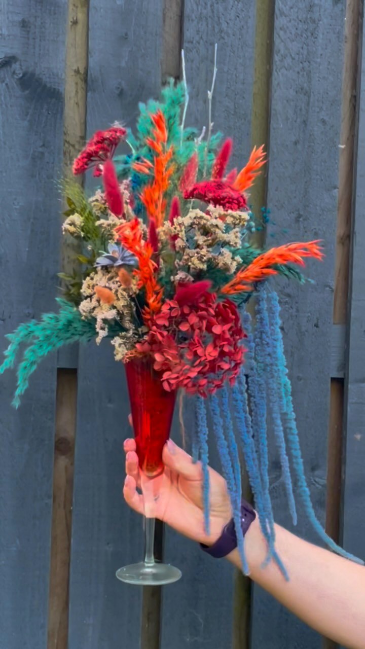 Hand-tied dried flower arrangement in a coupe glass